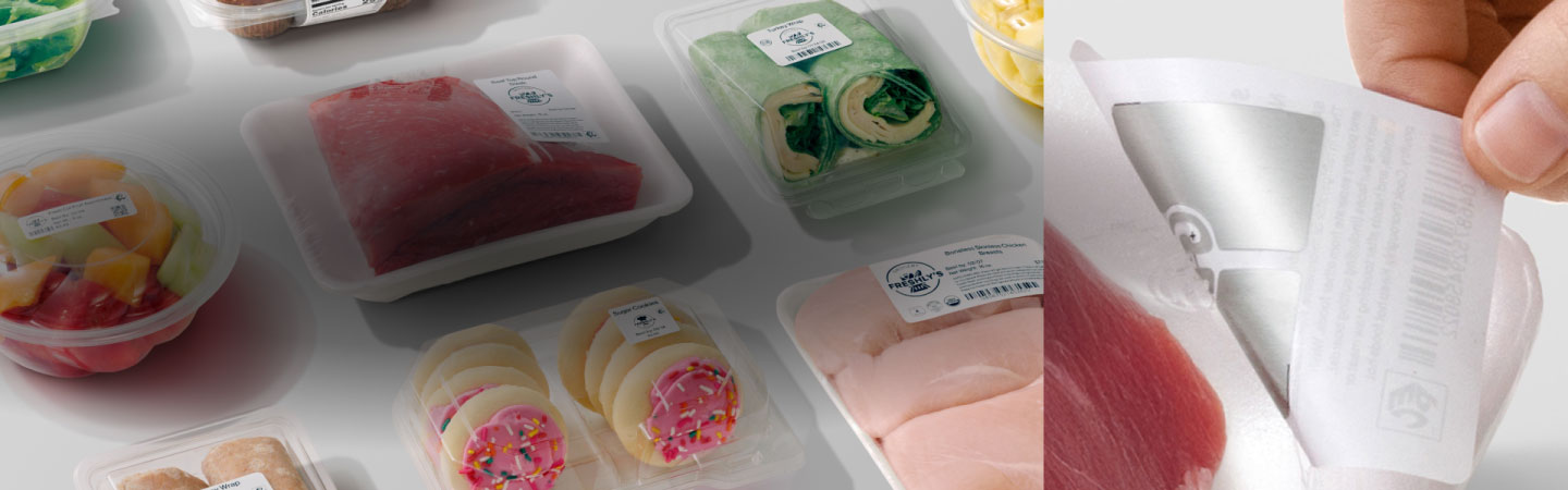 A man shopping in the grocery store holding a basket full of food
